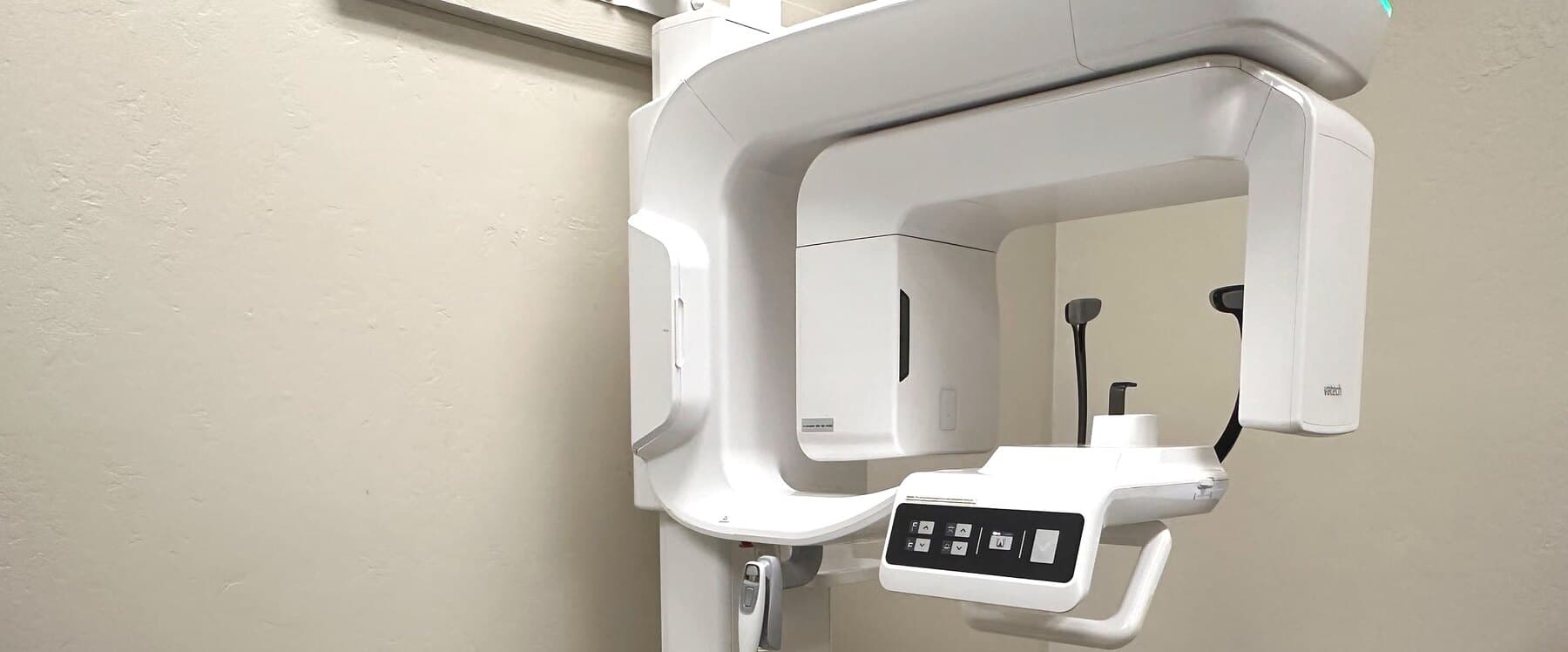 A treatment room at Premier Periodontics, with the corridor to the other operatories beyond it